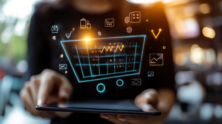 A person interacts with a digital tablet displaying graphs and icons, symbolizing data analysis and financial technology.